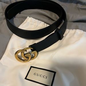 Gucci belt, black with gold buckle.
